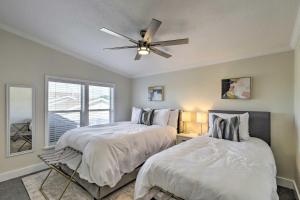 a bedroom with two beds and a ceiling fan at Lovely Lehi Retreat 27 Mi to Alta Ski Area! in Lehi