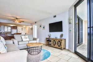 a living room with a couch and a tv at Sundestin Beach Resort 0615 in Destin