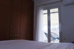 Posteľ alebo postele v izbe v ubytovaní Penthouse with Acropolis View