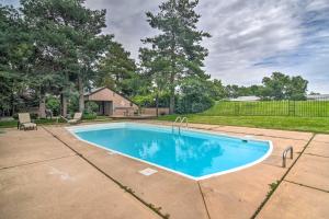 a swimming pool in the backyard of a home at Loveland Townhome Walkable to Lake and Park! in Loveland