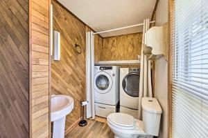 a bathroom with a washing machine and a washer and dryer at Family-Friendly Sanctuary BBQ, Patio and Yard in Oak Hill +25 photos