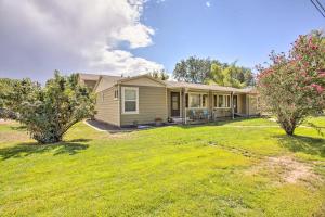 a house with a yard in front of it at Well-Appointed Fruita Townhome Hike and Bike Nearby in Fruita