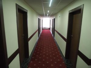 a hallway with a stairway leading to a hallway at Bononia Hotel in Vidin