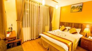 Postel nebo postele na pokoji v ubytování Heart Of Sapa Hotel