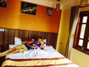 Postel nebo postele na pokoji v ubytování Heart Of Sapa Hotel