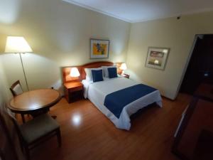 Łóżko lub łóżka w pokoju w obiekcie Summit Suítes Hotel Jundiaí