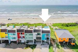 an aerial view of a house on the beach at Beachfront Retreat FREE use of GOLF CART in Surfside Beach