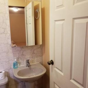 a bathroom with a sink and a mirror at CASA VICTORIA in San Pedro de Atacama