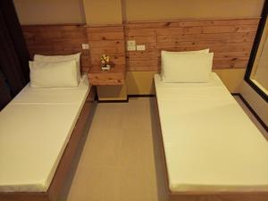 Postel nebo postele na pokoji v ubytování GHIELLANIQA INN