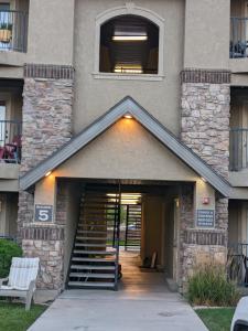 a building with a stairway leading into a building at The Tuscan Lodge in Payson