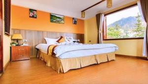 Postel nebo postele na pokoji v ubytování Heart Of Sapa Hotel + 24 fotografií