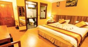 Postel nebo postele na pokoji v ubytování Heart Of Sapa Hotel