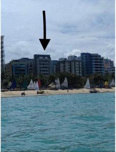 a view of a beach with boats in the water at NEO B MAR PAJUCARA 2Qts 2WIFI 2 GARAGENS- Adm Nutelss in Maceió
