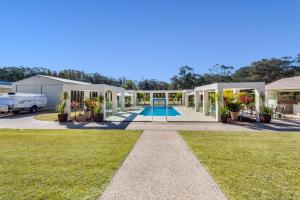 a house with a swimming pool in a yard at One Mile Mansion - Private Coastal Retreat in One Mile