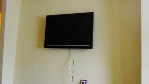 A television and/or entertainment center at Studio apartment Zaporozhye
