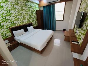 Postel nebo postele na pokoji v ubytování Hotel Asopalav
