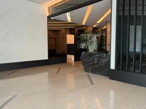 an empty lobby of a building with glass doors at Datum Jelatek MHQ NAF Perfect, Relaxing, Sky Ring Bridge in Kampong Datok Keramat