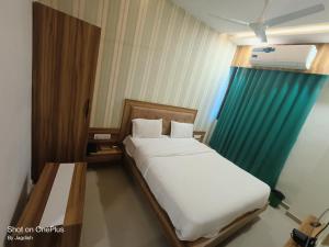 Postel nebo postele na pokoji v ubytování Hotel Asopalav