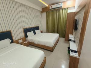 Postel nebo postele na pokoji v ubytování Hotel Asopalav