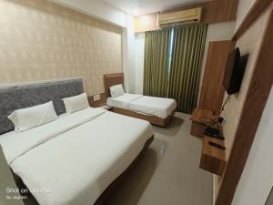 Postel nebo postele na pokoji v ubytování Hotel Asopalav