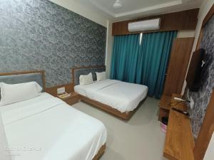 Postel nebo postele na pokoji v ubytování Hotel Asopalav