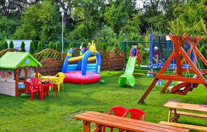 a park with a playground with children playing on it at 2 Bedroom Stunning Home In Sianozety in Sianozety