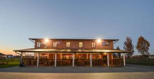 a large building with lights on top of it at Rooms with a parking space Slavonski Brod, Slavonija - 19326 in Garčin