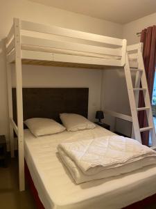 Posteľ alebo postele v izbe v ubytovaní Appartement en centre ville à 30m du télécabine