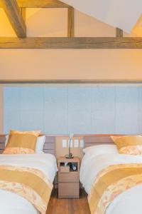 En eller flere senge i et værelse på 縁や 出雲-ENISHIYA IZUMO-