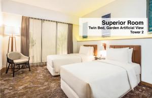 Postel nebo postele na pokoji v ubytování Swiss-Belinn Singkawang