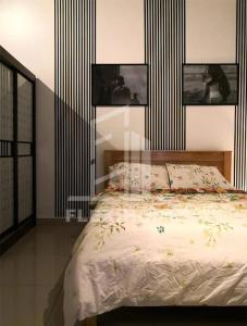a bedroom with a bed with three pictures on the wall at Colour-Theme Designed, Private Studio Home, Cybersquare 27B Cyberjaya, Flexihome-MY in Cyberjaya