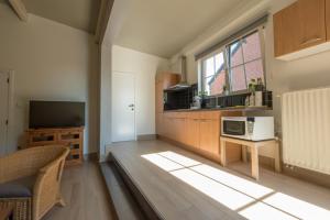 Kuchyň nebo kuchyňský kout v ubytování Vakantiewoningen Pomona