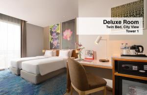 Postel nebo postele na pokoji v ubytování Swiss-Belinn Singkawang