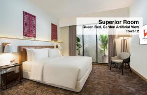Postel nebo postele na pokoji v ubytování Swiss-Belinn Singkawang