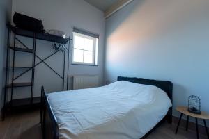 Postel nebo postele na pokoji v ubytování Vakantiewoningen Pomona