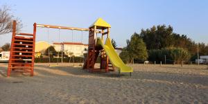 a playground with a slide and a slideintend at Aurora Apartments-Nin- 25m to the Beach in Nin
