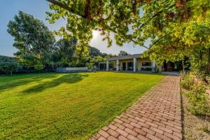 a brick walkway in front of a house at Heliophos Villa Aitheria in Kiotari