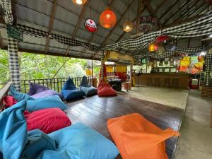 a group of pillows on the floor of a tent at Bulian Homestay in Kubutambahan
