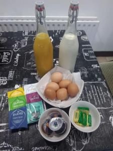 a table with two bottles of milk and some eggs at Umry Lodge in Antrim