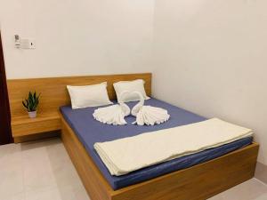 Postel nebo postele na pokoji v ubytování Nhà Nghỉ LÂM ANH
