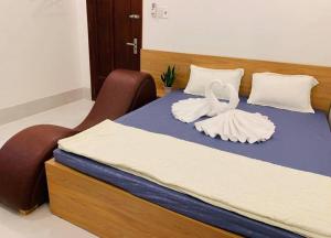 Postel nebo postele na pokoji v ubytování Nhà Nghỉ LÂM ANH