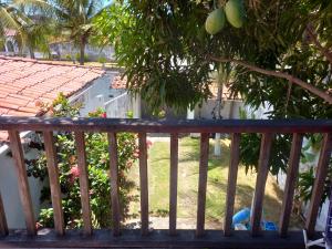 a view from the balcony of a house with a yard at Paracuru Olaonda wavehostel in Paracuru