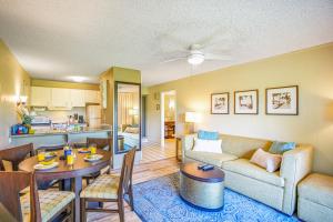 a living room with a couch and a table at Plantation Hale D10 in Kapaa