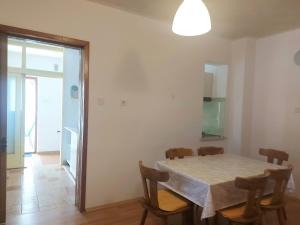 a dining room with a table and chairs at Apartment Iva Pula in Banjole