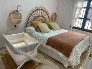 A bed or beds in a room at El descanso del almorávide