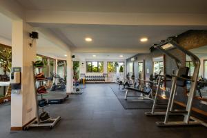 a gym with treadmills and elliptical machines at Z Hotel in Nungwi