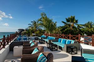 a resort patio with chairs and the ocean at Z Hotel in Nungwi