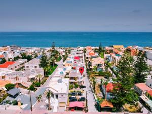 an aerial view of a city with the ocean at Marias Studios and Apartments in Plataniás
