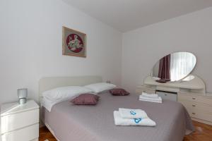 Postel nebo postele na pokoji v ubytování Apartments Tolic