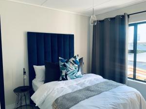 Katil atau katil-katil dalam bilik di Apartment in Boksburg
